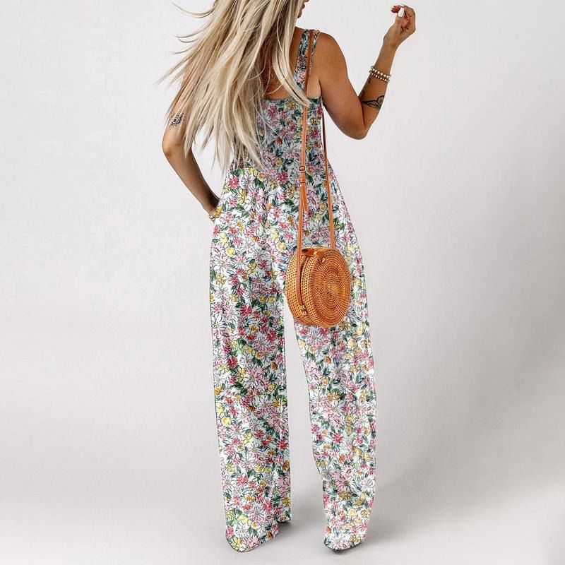 Blomstret, ermeløs jumpsuit for damer – smocket brystparti og vide ben – sommerlig chic 👒�