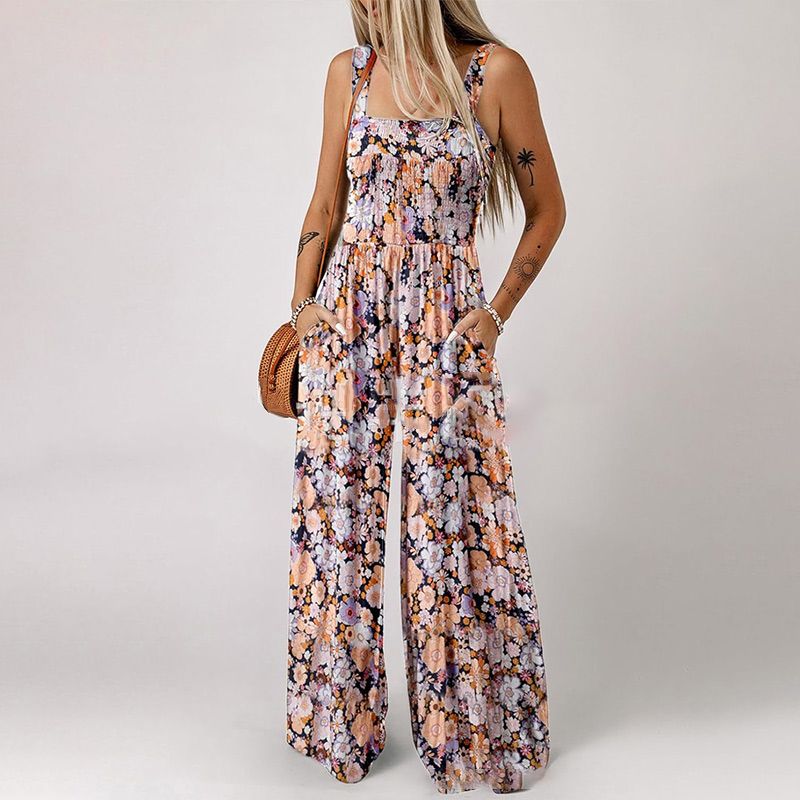 Blomstret, ermeløs jumpsuit for damer – smocket brystparti og vide ben – sommerlig chic 👒�